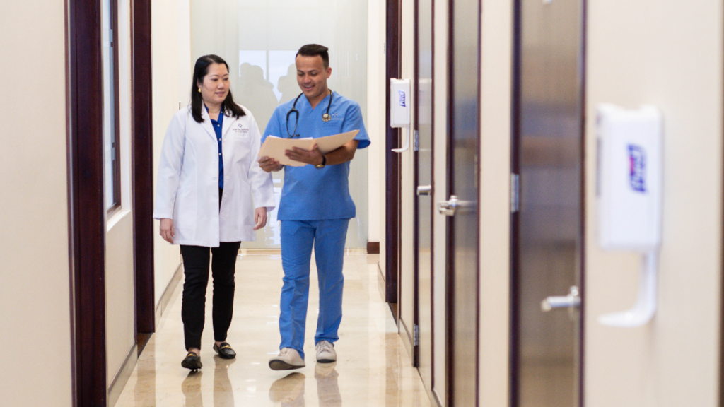 Doctor and nurse discussing a patient's medical file