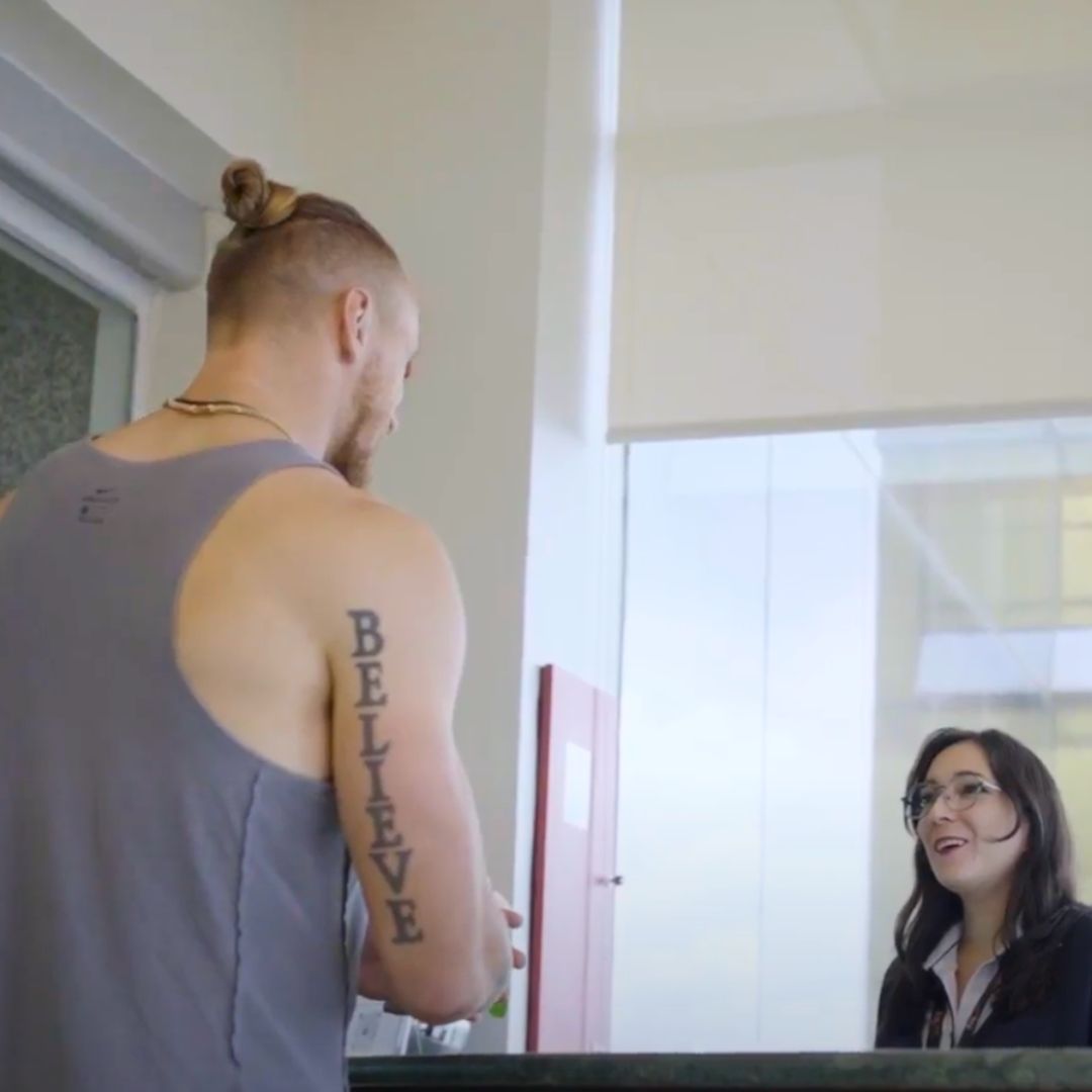 George Kittle at the Stem Cell Institute front desk