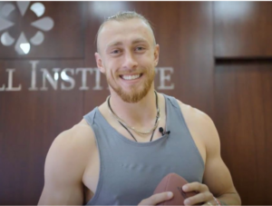 stem cells George Kittle smiling with a football at Stem Cell Institute Panama