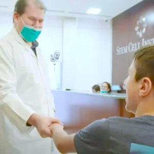Stem Cell Institute doctor shaking Owen's hand