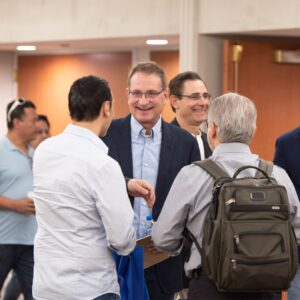 Dr. Neil Riordan talking to attendees at Stem Cell Institute's Miami seminar