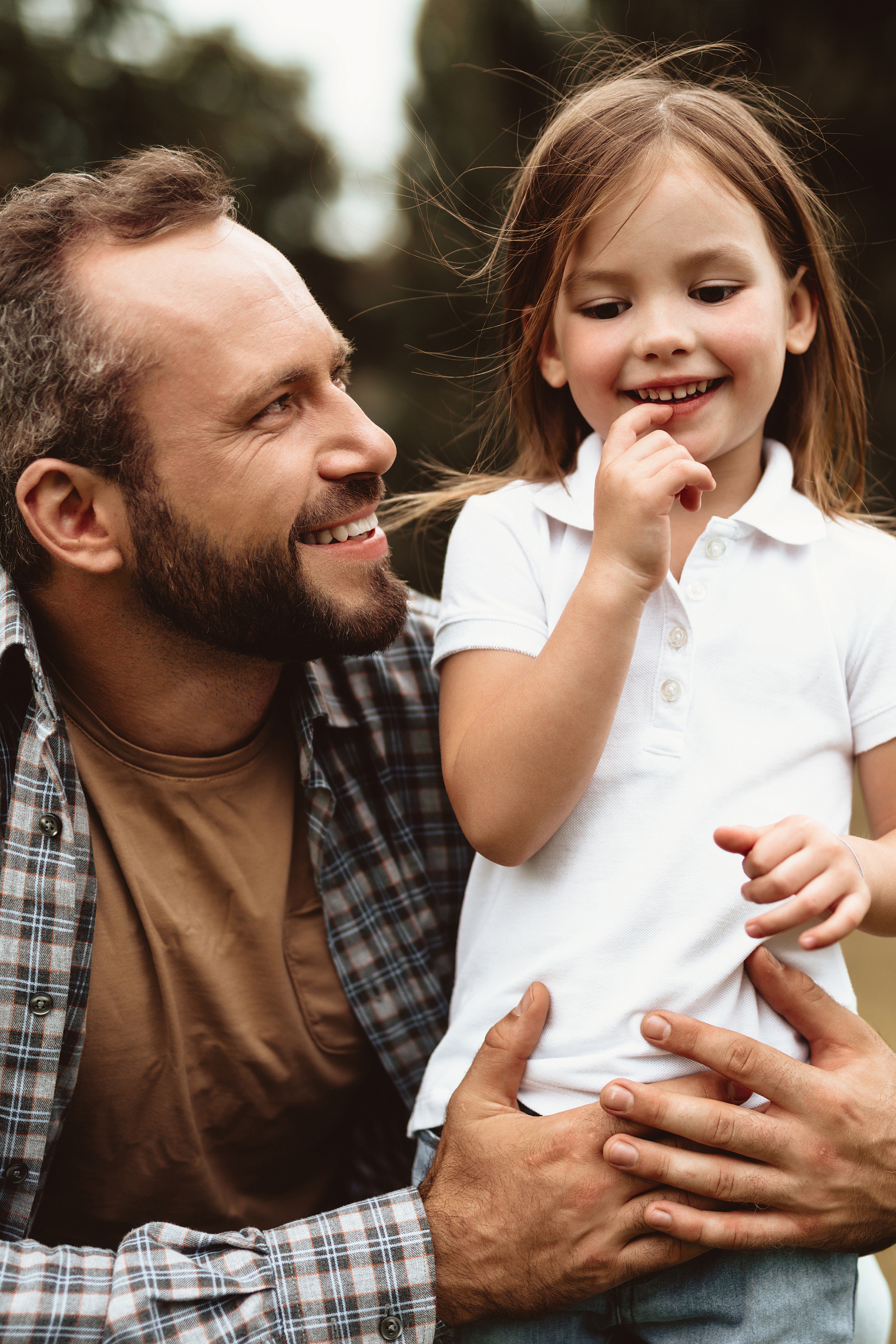 Father and daughter smiling