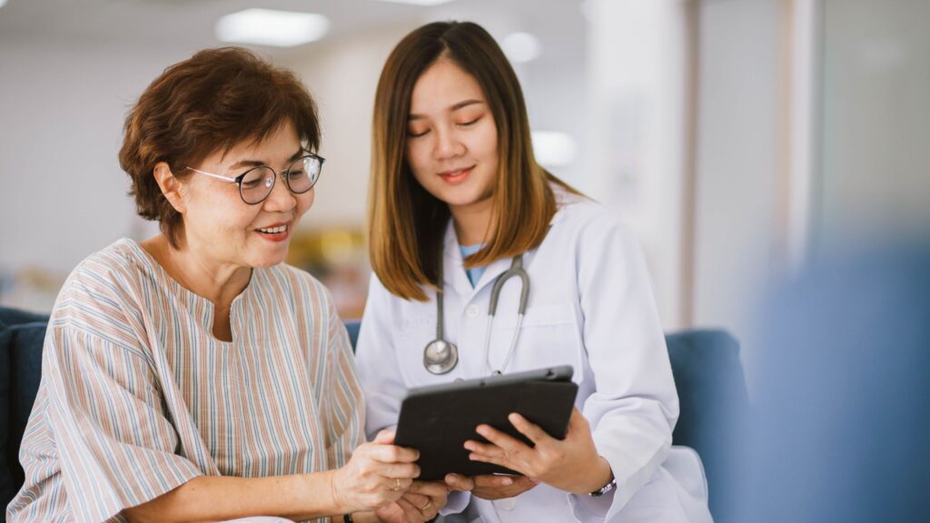 Patient talking to receptionist about their stem cell therapy