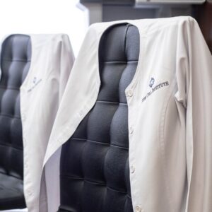 Stem Cell Institute doctor’s coat laying over a chair