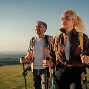 Wellness & Longevity middle-aged woman and man hiking