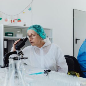 Regenerative medicine researcher in a lab looking into a microscope