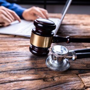 law gavel and stethoscope in doctor malpractice court